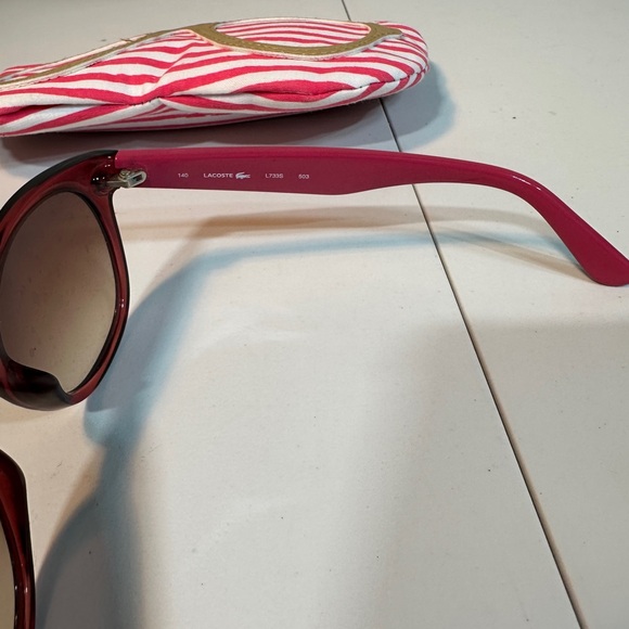 Pink women’s Lacoste sunglasses with pink striped carrying pouch main image 10